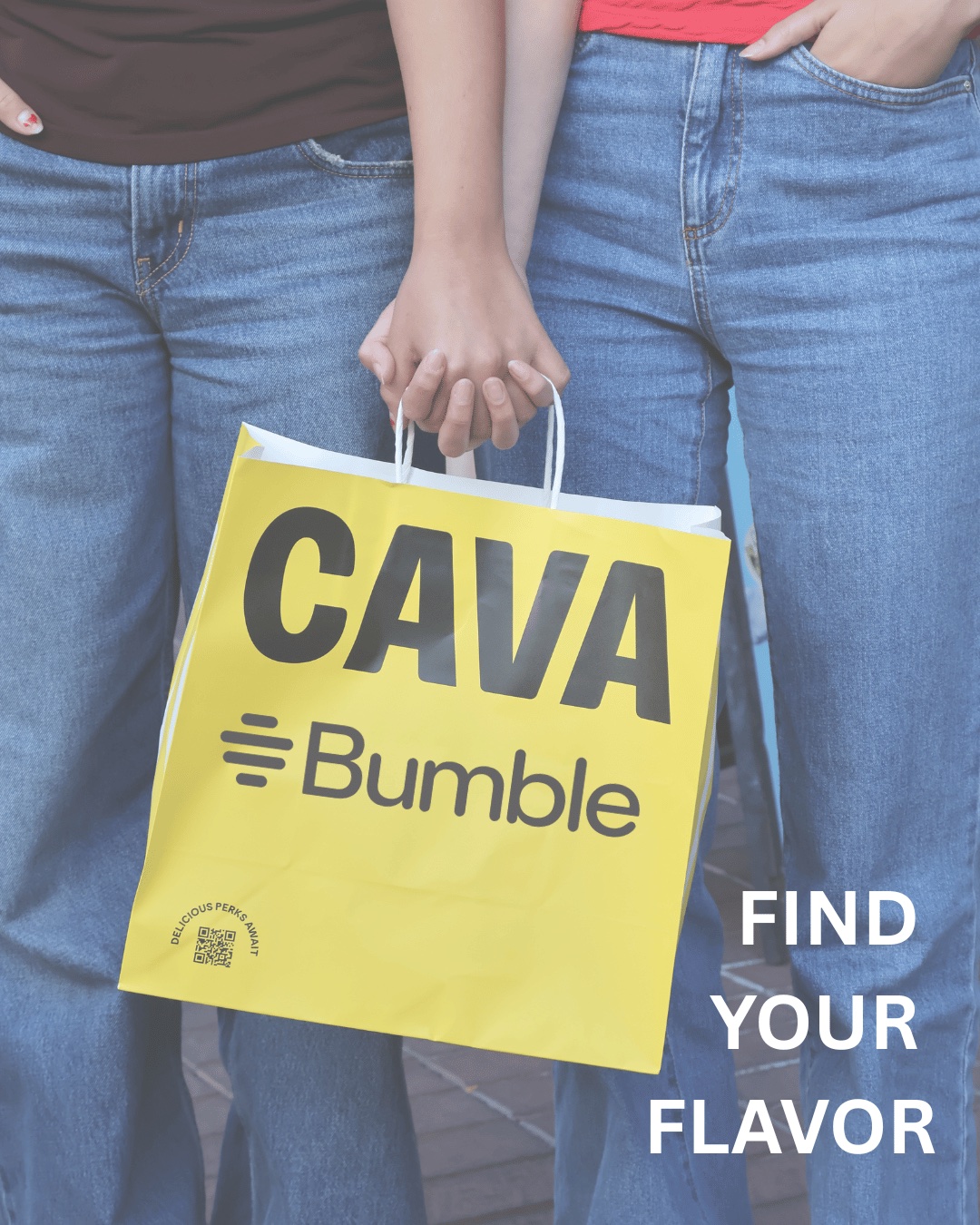 Two friends walking with a co-branded CAVA x Bumble bag reading 